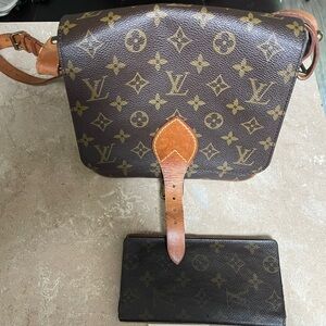 Louis Vuitton purse and wallet.